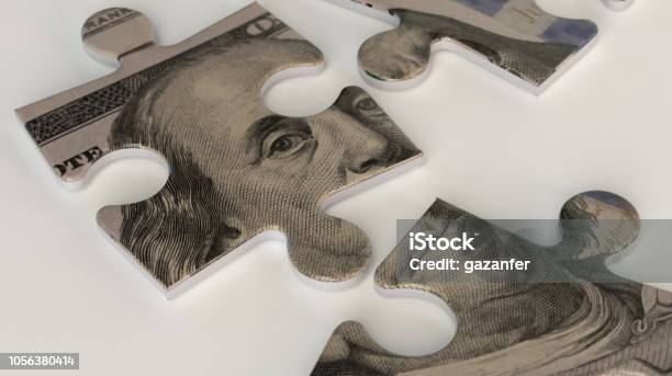 A One Hundred Dollar Bill Puzzle Stock Photo - Download Image Now - Finance, Wealth, Choice