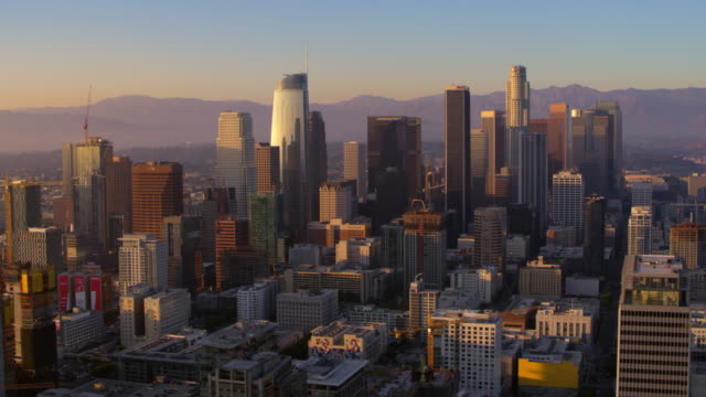 Aerial shot of the business buildings in Downtown Los Angeles at sunset. Shot in CA, USA.
