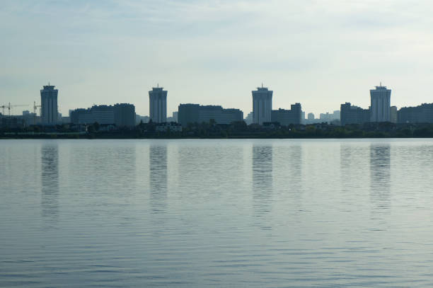 istock Modern districts silhouette on on the river bank. 1056383078