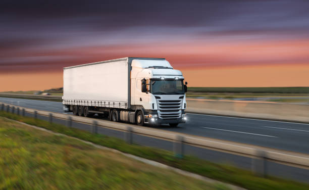 istock Truck with container on road, cargo transportation concept. 1056387854