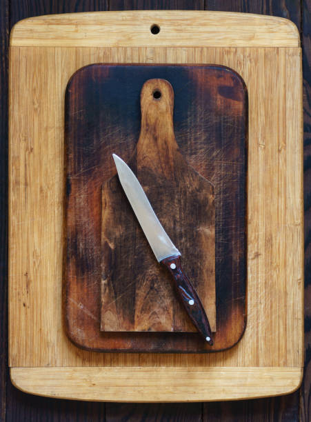 istock Various wooden cutting boards and kitchen knife 1056388350