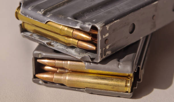 istock Two metal rifle magazines, one stacked upon the other 1056388700