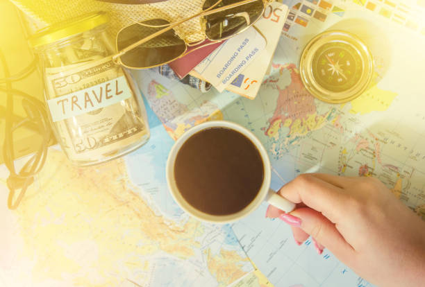 istock Background the journey, the reflection in the Cup of coffee. Map. Selective focus. 1056390484