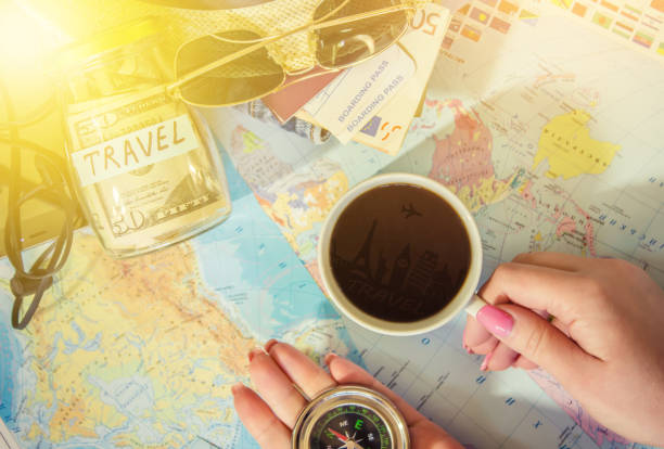 istock Background the journey, the reflection in the Cup of coffee. Map. Selective focus. 1056390502