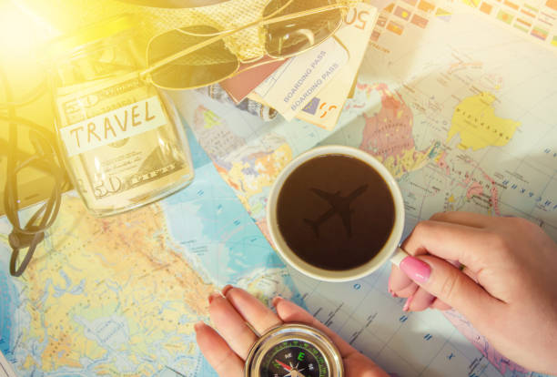 istock Background the journey, the reflection in the Cup of coffee. Map. Selective focus. 1056390504