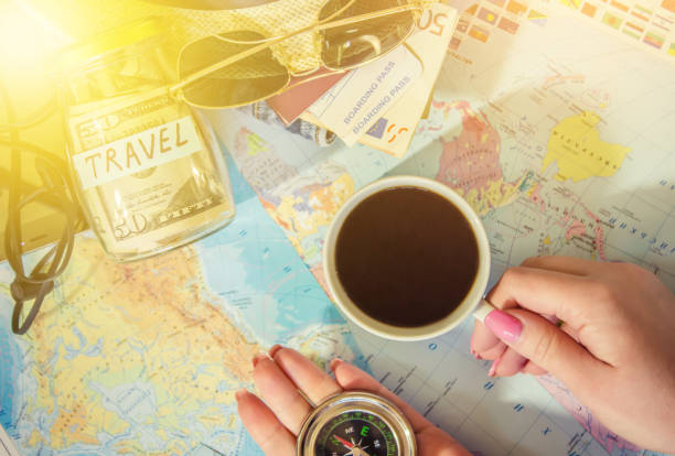 istock Background the journey, the reflection in the Cup of coffee. Map. Selective focus. 1056390526