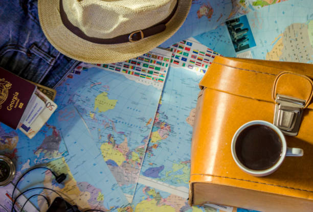 istock Background the journey, the reflection in the Cup of coffee. Map. Selective focus. 1056390582