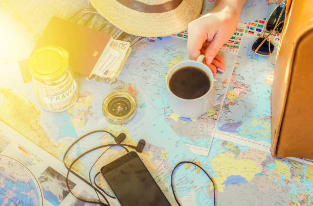 istock Background the journey, the reflection in the Cup of coffee. Map. Selective focus. 1056390686