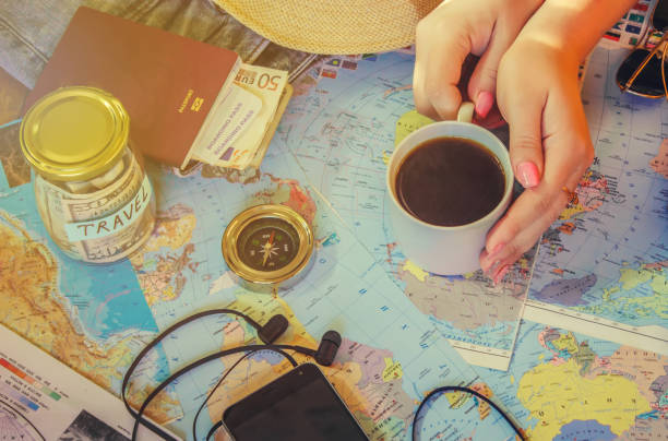 istock Background the journey, the reflection in the Cup of coffee. Map. Selective focus. 1056390690
