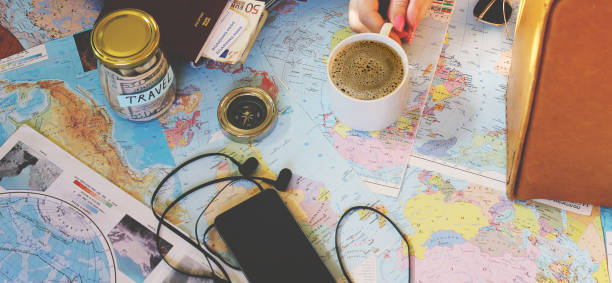 istock Background the journey, the reflection in the Cup of coffee. Map. Selective focus. 1056390716