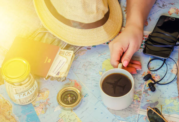 istock Background the journey, the reflection in the Cup of coffee. Map. Selective focus. 1056390724