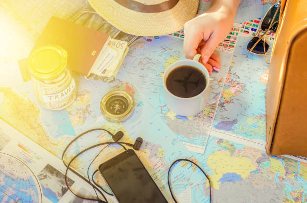 istock Background the journey, the reflection in the Cup of coffee. Map. Selective focus. 1056390728