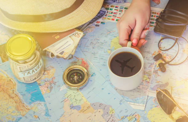 istock Background the journey, the reflection in the Cup of coffee. Map. Selective focus. 1056390746