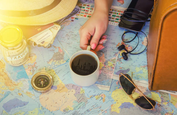 istock Background the journey, the reflection in the Cup of coffee. Map. Selective focus. 1056390766