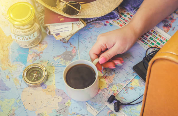 istock Background the journey, the reflection in the Cup of coffee. Map. Selective focus. 1056390780