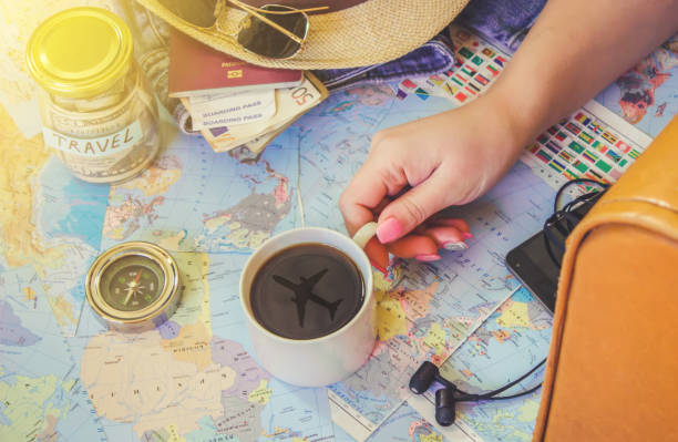 istock Background the journey, the reflection in the Cup of coffee. Map. Selective focus. 1056390782