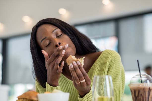 istock Young black woman at lunch 1056392724