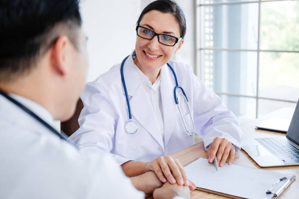 istock The doctor encourage the patient with smile. 1056395588