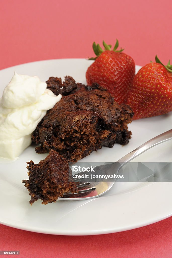 Hot fudge pudding cake Hot fudge pudding cake, presented with whipped cream and fresh strawberries. Focus is on the front of the cake piece. ALSO see these similar pictures: Chocolate Stock Photo