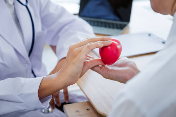 istock The doctoe give heart to patient. 1056396728