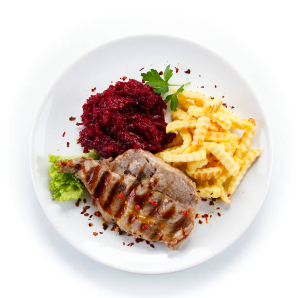 Grilled steak with French fries and vegetables