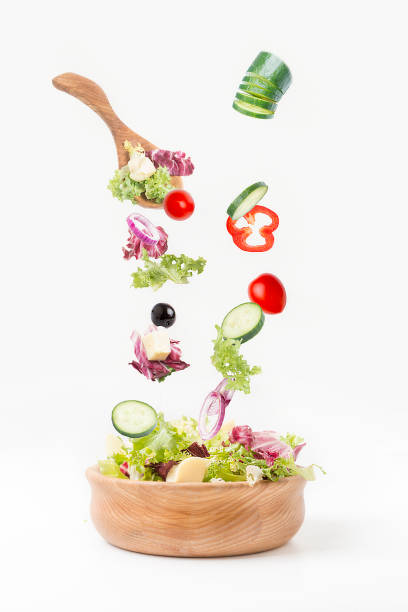 istock Vegetables for preparation of salad on a white background. 1056401244