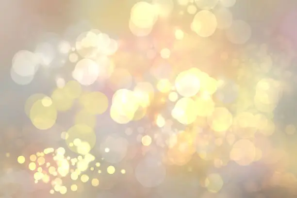 Abstract golden festive bokeh background with glitter sparkle blurred circles and Christmas lights. Concept Christmas, Happy New Year and other holidays.