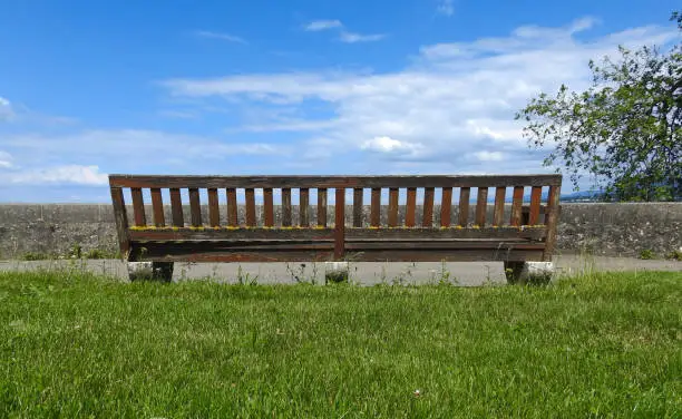This wooden bench sits on the square in front of the world trade organization building in Geneva, Switzerland.