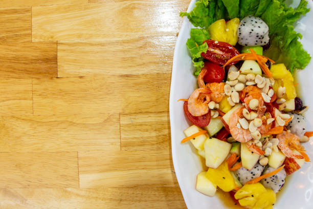 istock Spicy fruit salad with dried shrimp 1056416730