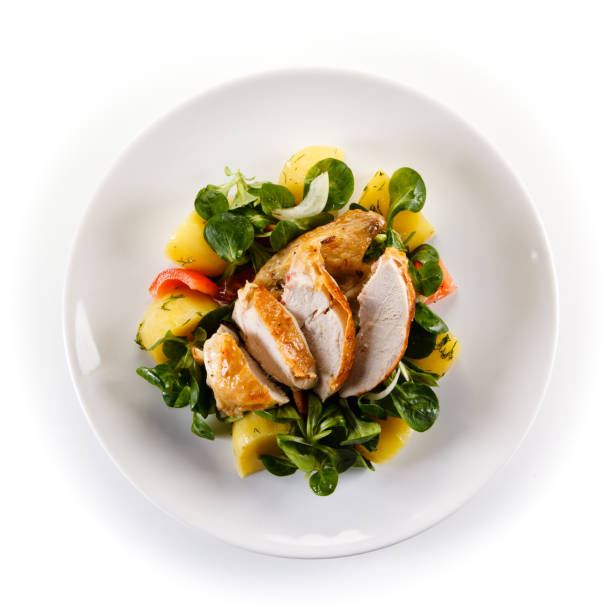 Grilled chicken breast and vegetables Grilled chicken breast and vegetables on white background turkey meat photos stock pictures, royalty-free photos & images