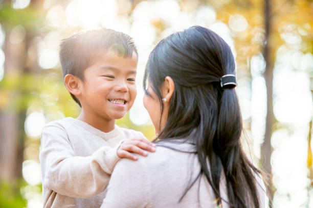 istock Son looks into his mom's eyes while smiling 1056424772