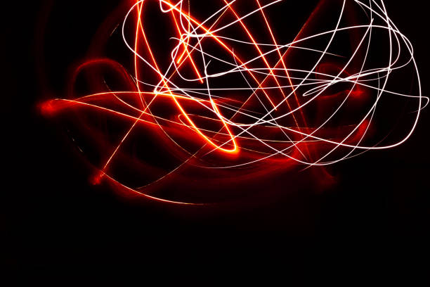 istock Intricate Light Painted Shapes With Red Flashlight At Night 1056429358