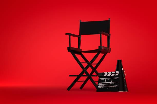 3d Directors chair on film set on red background 3d Directors chair on film set on red background hollywood stock pictures, royalty-free photos & images