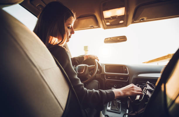 istock Businesswoman driving a car 1056441732