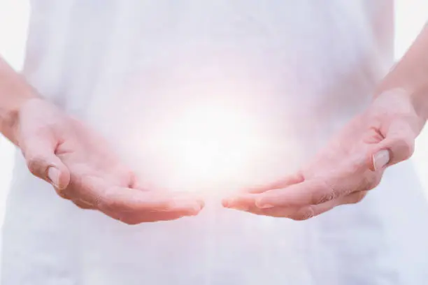 Close up horizontal image of distance healing hands of therapist at Reiki healing treatment. Alternative therapy concept