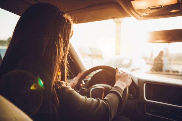 istock Businesswoman driving a car 1056443448