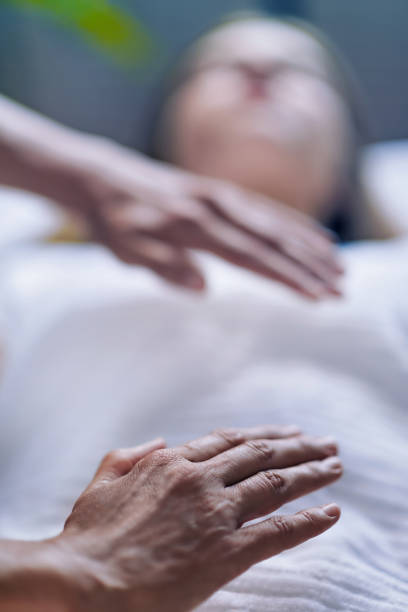 istock Hands At Reiki Healing Treatment 1056443508