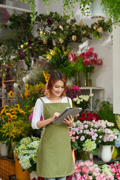istock Flower shop owner 1056444654