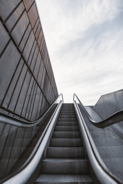 istock Outdoor city escalator with the wall on the left 1056445020