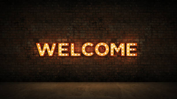 muestra de neón sobre fondo de pared de ladrillo - bienvenida. render 3d - illuminated sign fotografías e imágenes de stock