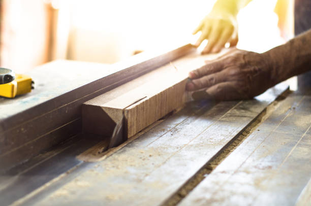 istock Carpenter tools on wooden table with sawdust. Circular Saw. Cutting a wooden plank 1056448864