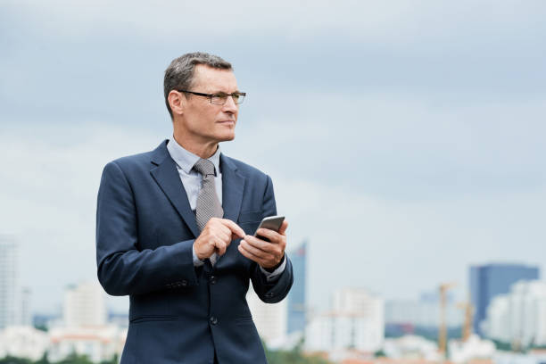 istock Ambitious businessman dialing number 1056451754
