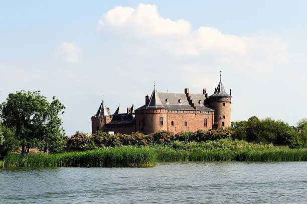 The castle of Muiden (local "Muiderslot")near Amsterdam in The Netherlands as seen from the river "Vecht".