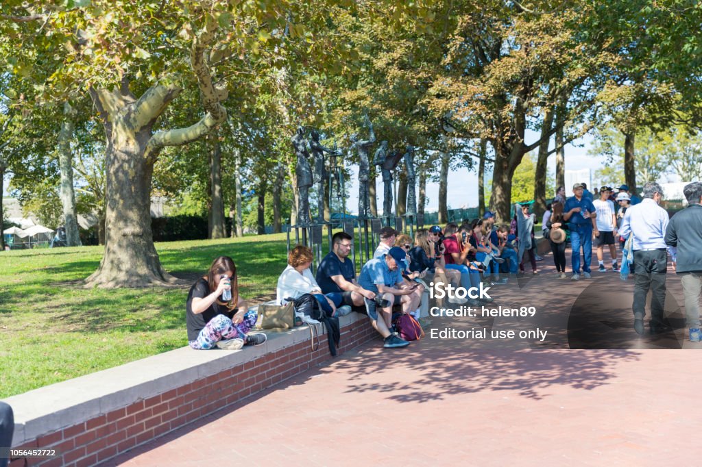 People Are Sitting On The Roadside In New Jersey Park Stock Photo - Download  Image Now - iStock