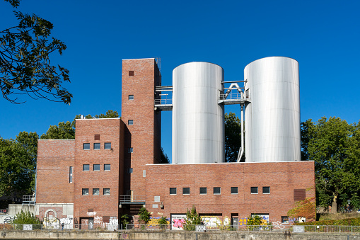 external architecture of a brewery with 4 production towers, travel reportage in Copenhagen