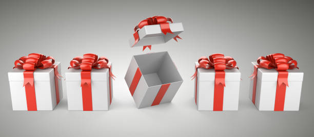 istock Row of gift with red bow and ribbon - one box open. 1056454568