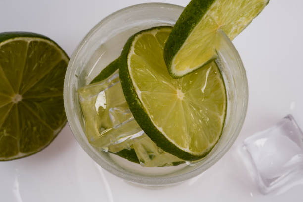istock Refreshing cocktail with green lemon and ice. 1056459606