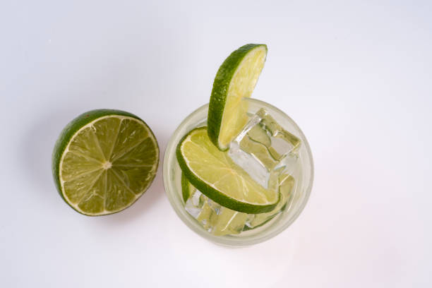istock Refreshing cocktail with green lemon and ice. 1056459612
