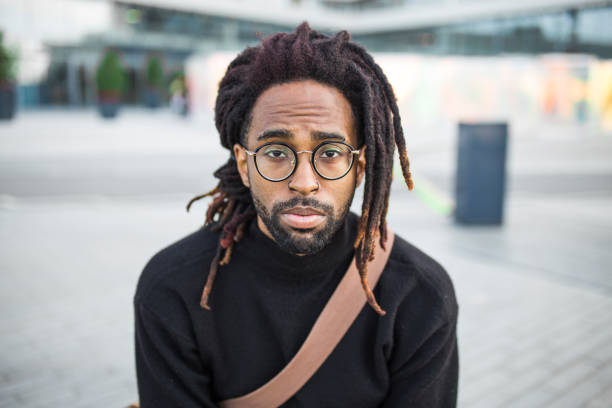 Portrait of a young african american man Portrait of a young african american man dreadlocks stock pictures, royalty-free photos & images