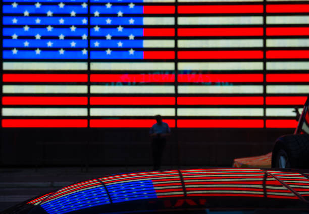 istock Car at Time Square, American flag in reflection 1056466234